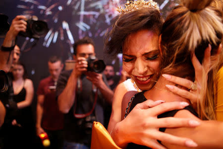 Talin Abu Hanah, an Israeli Arab, reacts after winning the first-ever Miss Trans Israel beauty pageant in Tel Aviv, Israel May 27, 2016. REUTERS/Amir Cohen