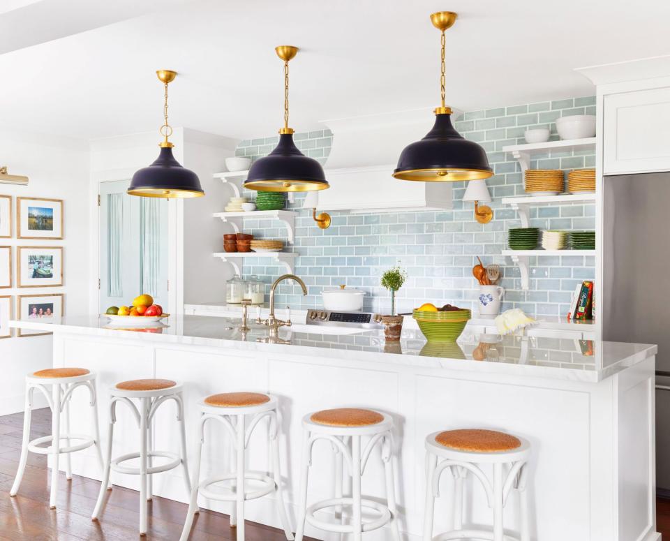 White Kitchen with Black Pendant Lights and Turquoise Subway Tile