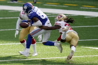 San Francisco 49ers' Marcell Harris, right, punches the ball away from New York Giants' Darius Slayton during the second half of an NFL football game, Sunday, Sept. 27, 2020, in East Rutherford, N.J. (AP Photo/Corey Sipkin)