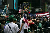 <p>People show support waving U.S. flags in Times Square, New York City during the “I am a Muslim too” rally on Feb. 19, 2017. (Gordon Donovan/Yahoo News) </p>