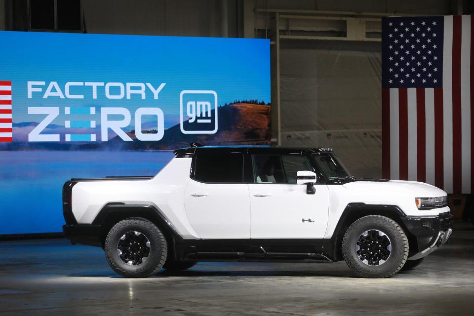 A GMC Hummer EV pickup sits on display before U.S. President Joe Biden speaks at the grand opening of GM's Detroit-Hamtramck EV Factory Zero on Nov. 17, 2021. The president added $7.5 billion to create new electric vehicle charging stations as part of his infrastructure package recently passed by Congress and signed into law on Monday.