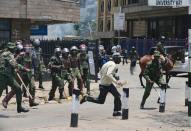 A supporter of the opposition National Super Alliance (NASA) coalition runs after riot policemen dispersed protesters during a demonstration calling for removal of Independent Electoral and Boundaries Commission (IEBC) officials in Nairobi, Kenya September 26, 2017. REUTERS/Thomas Mukoya