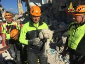 <p>A firefighter holds a rescued dog in Amatrice, central Italy, Thursday, Aug. 25, 2016. (Italian Firefighters Vigili del Fuoco via AP) </p>