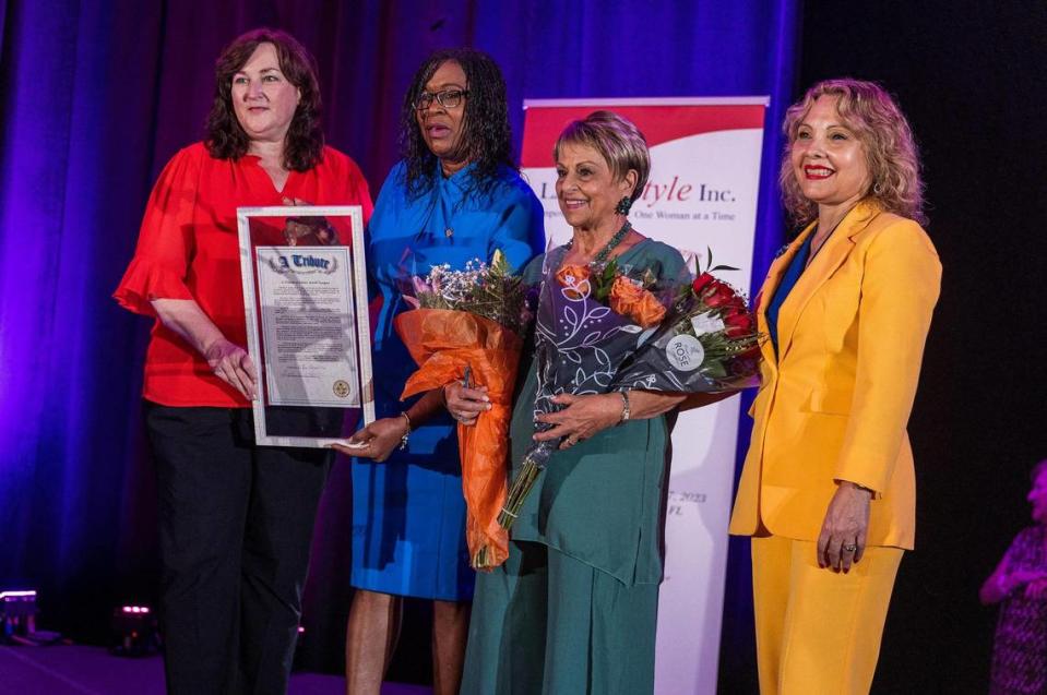 Florida state representatives, from left, Christine Hunschofsky and Marie Woodson and Dr. Rachel Tourgeman, far right, present a proclamation Friday to honor Elaine Miceli-Vasquez, founder and president of El Heraldo de Broward. Pedro Portal/pportal@miamiherald.com