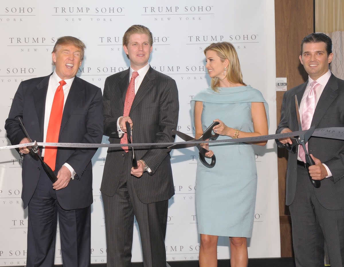 Donald Trump and his children Eric Trump, Ivanka Trump and Donald Trump Jr attend the ribbon cutting ceremony for Trump SoHo New York in April 2010 (Photo by Michael Loccisano/Getty Images for Trump SoHo)