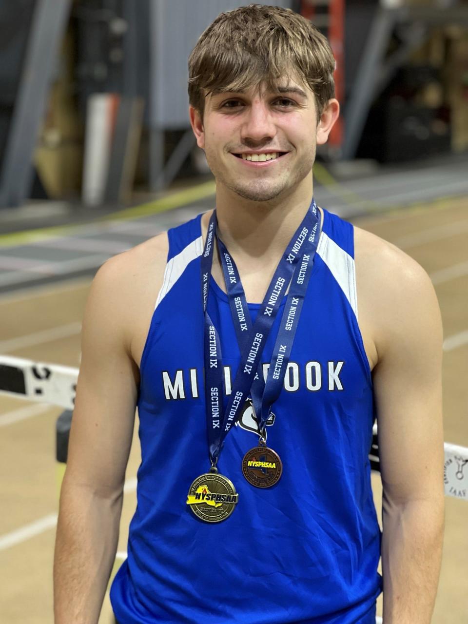 Millbrook's Nolan Kozera poses after winning the 300 meters at the Section 9 Class B track and field championships.