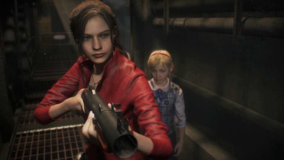 Marketing still from the Resident Evil 2 remake.  Claire Redfield (heroine) holds a shotgun as she walks down the hall with a child behind her.