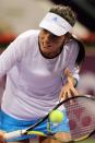 Ana Ivanovic of Serbia returns the ball to Daniela Hantuchova of Slovakia during the second day of the WTA Qatar Ladies Open in Doha, Qatar, Tuesday Feb. 11, 2014. (AP Photo/Osama Faisal)