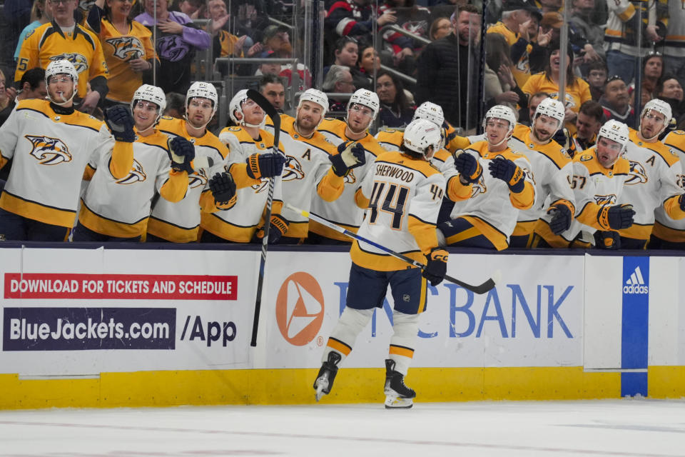 Nashville Predators' Kiefer Sherwood (44) celebrates scoring a goal with teammates during the first period of an NHL hockey game against the Columbus Blue Jackets, Saturday, March 9, 2024, in Columbus, Ohio. (AP Photo/Aaron Doster)
