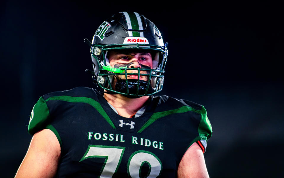 Fossil Ridge football star Gage Ginther walks off the field in disappointment after losing the Harmony Cup against crosstown rival Fort Collins during the Canvas Classic at Canvas Stadium on Oct. 6.