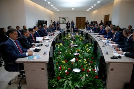 Delegations, led by Russian Deputy Prime Minister Yury Borisov and Venezuelan Industries Minister Tareck El Aissami, hold a meeting in Caracas