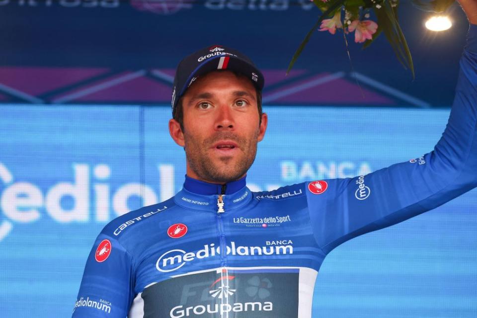 Groupama  FDJs French rider Thibaut Pinot celebrates his best climber blue jersey on the podium after the fourth stage of the Giro dItalia 2023 cycling race 175 km between Venosa and Lago Laceno on May 9 2023 Photo by Luca Bettini  AFP Photo by LUCA BETTINIAFP via Getty Images