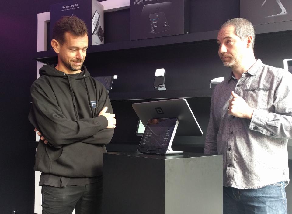 Square/Twitter CEO Jack Dorsey with Square’s head of product Jesse Dorogusker demonstrating the new Square Register. (Yahoo Finance)
