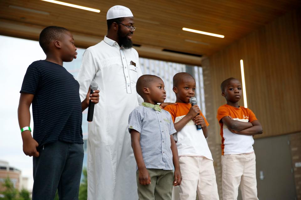 Youths recite passages from the Quran at the 2023 United Eid Festival celebrating Eid ul-Adha at Scissortail Park in Oklahoma City.