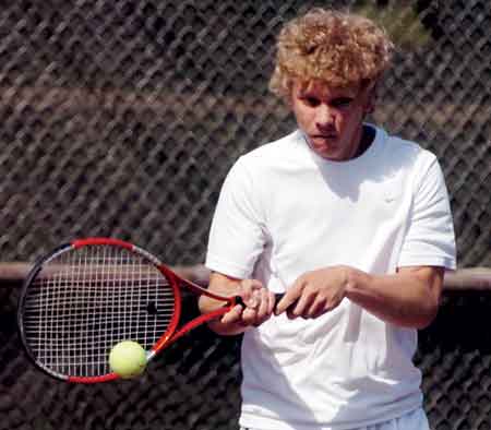 Watertown’s David Brandsrud, a regular for the Arrows from 2007-09, returns a shot during the No. 3 doubles match against Brandon Valley during a high school boys tennis dual.