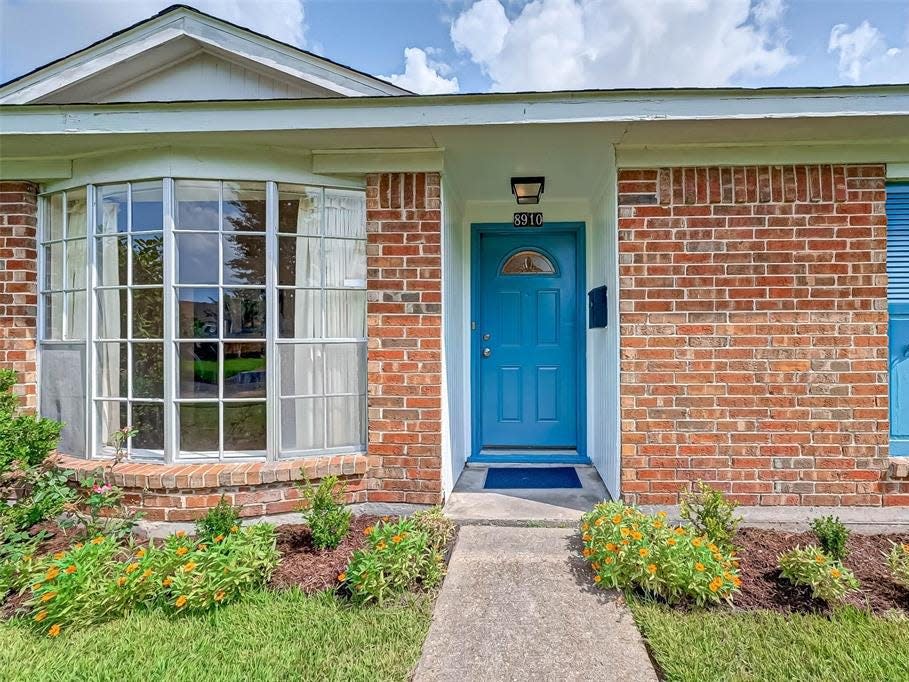 a close up of the blue door on a house for sale in houston