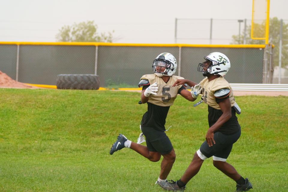 Senior defensive back, Cole Martin (left), practices with the Basha High School football team at the school's practice fields on Oct. 3, 2022, in Chandler, AZ.
