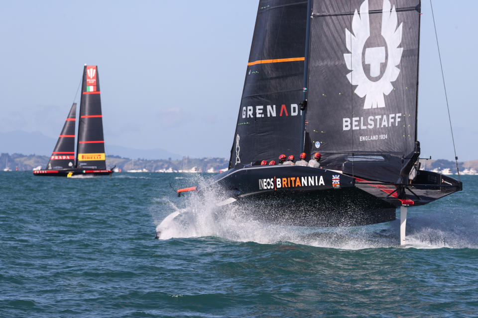 Britain's INEOS Team UK, right, trails Italy's Luna Rossa in race seven of the Prada Cup on Auckland's Waitemata Harbour, New Zealand, Sunday, Feb.21, 2021. (Brett Phibbs/NZ Herald via AP)