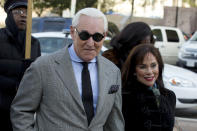 FILE - In this Nov. 14, 2019, file photo, Roger Stone accompanied by his wife Nydia Stone, right, arrives at federal court in Washington. (AP Photo/Jose Luis Magana, File)