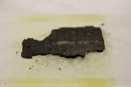 Fragment of Herculaneum scroll is fixed in place at a Diamond Light Source experimental station after it was scanned using bright x-rays in Didcot