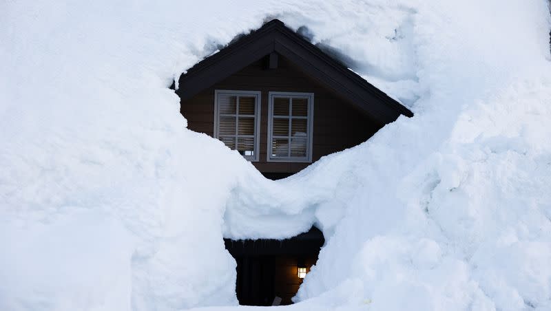 Snow covers a condominium home in Alta on April 9, 2023.