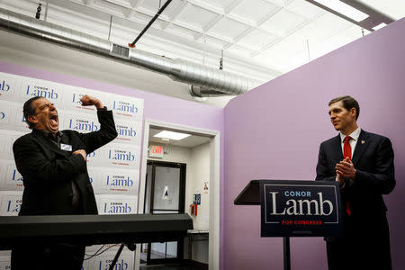 Jon "Bowzer" Bauman, a band member of the group Sha Na Na, strikes his signature pose during an introduction and endorsement for Congressional candidate Conor Lamb in Carnegie, Pennsylvania, U.S., February 16, 2018. Picture taken February 16, 2018. REUTERS/Maranie Staab