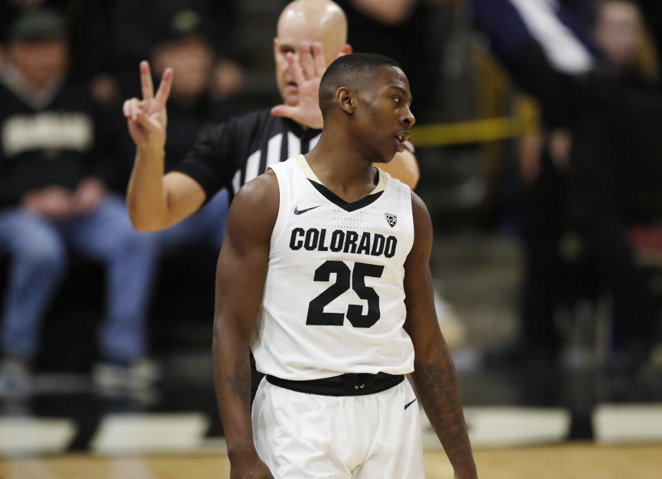 Colorado guard McKinley Wright IV, front, reacts as he is called for a foul against Oregon State in the second half of an NCAA college basketball game Sunday, Jan. 5, 2020, in Boulder, Colo. (AP Photo/David Zalubowski)