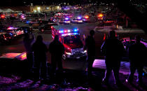 <p>People watch an ambulance leave at the scene of a shooting at a Walmart in Thornton, Colo., Nov. 1, 2017. (Photo: Rick Wilking/Reuters) </p>