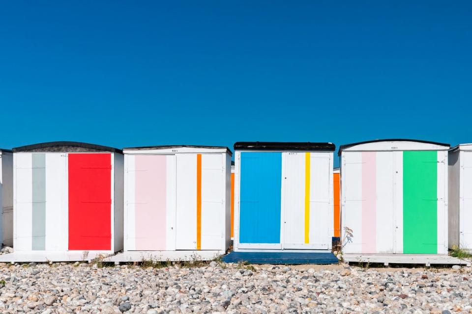 Bright beach huts on Le Havre’s pebble beach (Getty Images/iStockphoto)