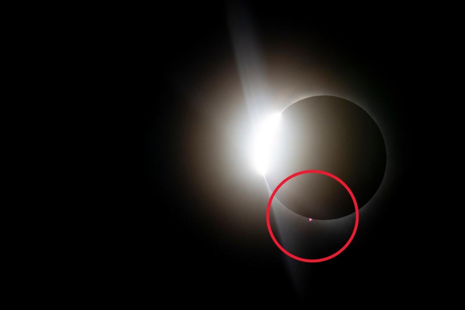 A view of the total solar eclipse reveals a solar prominence that shone reddish-pink during totality.