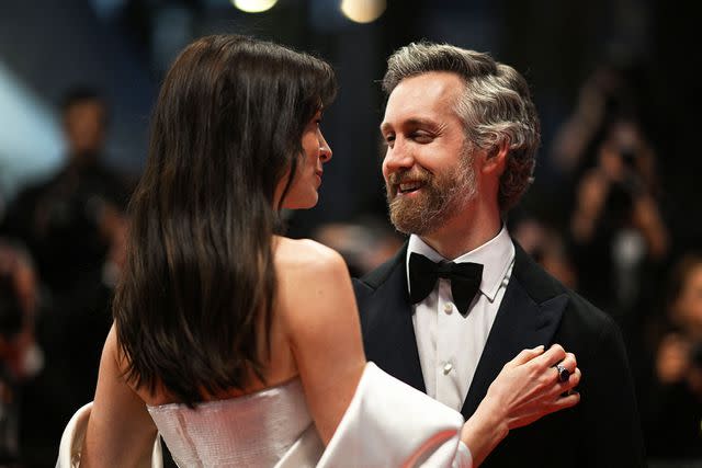 <p>Patricia De Melo Moreira/AFP via Getty</p> Anne Hathaway (L) and her husband Adam Shulman leave the Festival Palace following the screening of the film "Armageddon Time" during the 75th edition of the Cannes Film Festival in Cannes, southern France, on May 19, 2022.