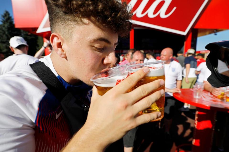 An England fan drinks beer at the FIFA Fan Zone in Volgograd, Russia (EPA)