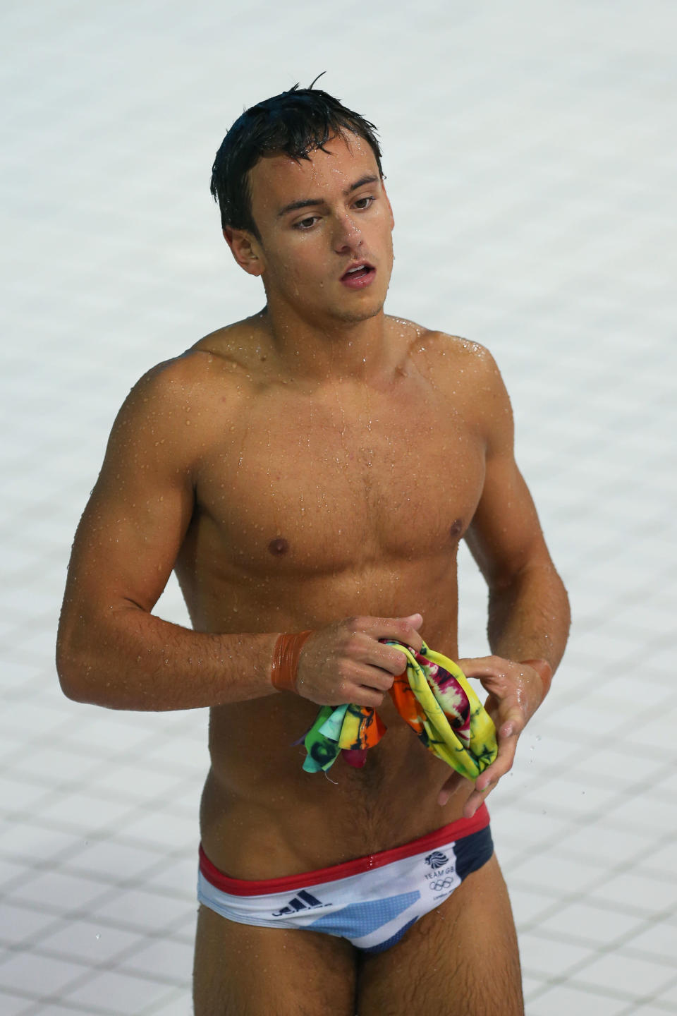 Much controversy has surrounded the British diver, Tom Daley, but one thing is indisputable his handsome face and sculpted body. (Photo by Clive Rose/Getty Images)