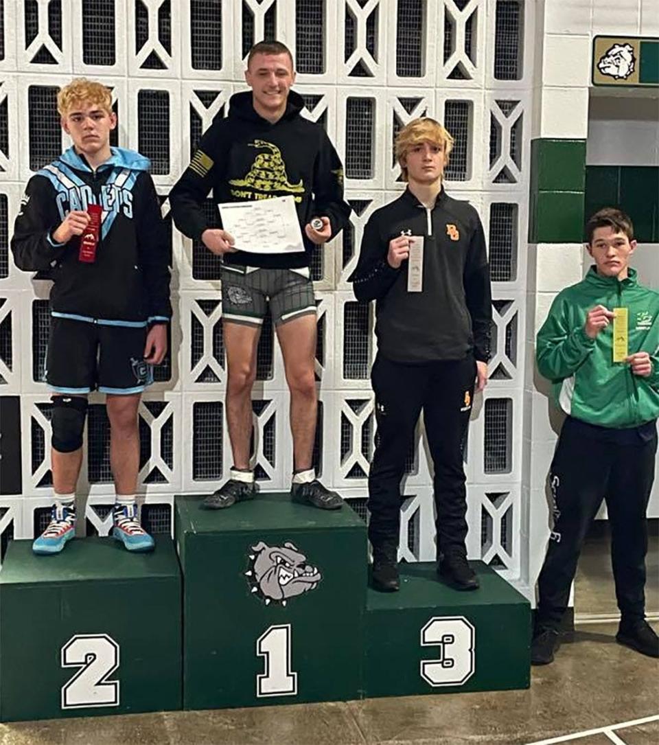 Monrovia wrestler Broden Goodman stood on top of the podium after winning the 138-pound weight class in the Indiana Crossroads Conference tournament.