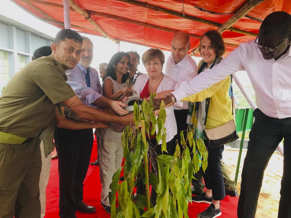 In this Wednesday, July 10, 2019 photo, World Bank’s Chief Executive Officer Kristalina Georgieva,center, along with other commissioners of the Global Commission on Adaptation to climate change, plants a tree inside the Rohingya refugees Co-ordination office at the southern coastal district of Cox's Bazar, Bangladesh. Former U.N. Secretary-General Ban Ki-moon who was visiting along with Georgieva has expressed concern that monsoon floods could threaten the lives of Rohingya refugees in sprawling camps in Bangladesh. Georgieva praised Bangladesh's progress in reducing damage and deaths from the monsoon season floods. (AP Photo/ Al-emrun Garjon)
