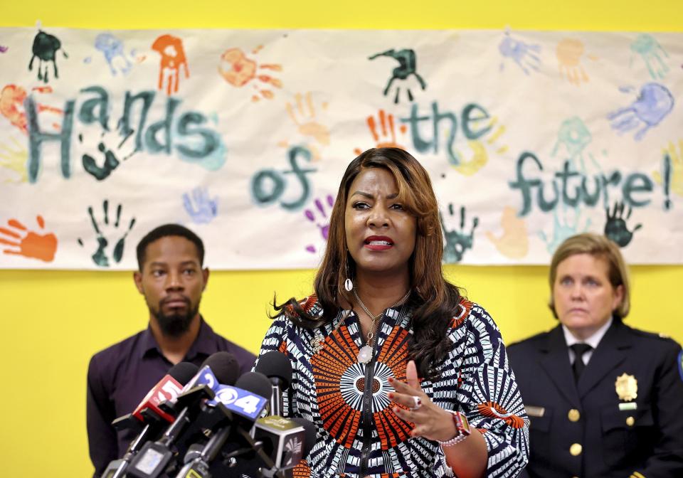 St. Louis Mayor Tishaura O. Jones, center, speaks during a news conference, Sunday, June 18, 2023, at the Wohl Recreation Center in St. Louis, about a shooting where 10 teens were shot overnight, one fatally, at a party in a building on Washington Avenue in downtown St. Louis. (David Carson/St. Louis Post-Dispatch via AP)