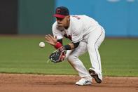 Cleveland Indians' Andres Gimenez fields a ball hit by Detroit Tigers' JaCoby Jones during the sixth inning in a baseball game, Friday, April 9, 2021, in Cleveland. Jones was out at first. (AP Photo/Tony Dejak)