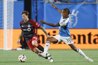 Toronto FC forward Federico Bernardeschi, left, and Charlotte FC forward Kerwin Vargas work for the ball during the second half of an MLS soccer match in Charlotte, N.C., Saturday, April 13, 2024. (AP Photo/Nell Redmond)