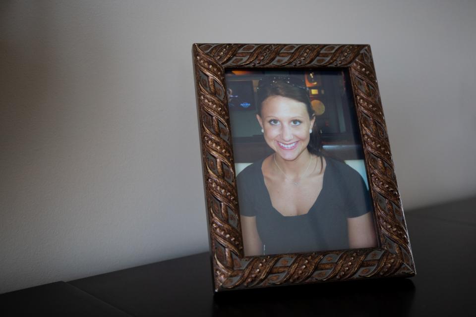 A framed picture of Lara Gass taken by her father, Jay Gass, in 2011 at a restaurant celebrating her brother's college graduation in Nashville, Tenn., photographed in Ponte Vedra Beach, Fla., on March 18, 2019. Lara Gass died at age 27 on March 18, 2014, in a car crash caused by a faulty ignition switch.