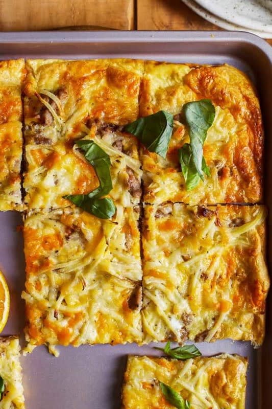 <p>The Cookie Rookie</p><p>From the crescent roll crust to the eggs and cheese and everything in between, this pizza is filling and so tasty. Plus this pizza is made in a sheet pan, so it’s super easy to make!</p><p><strong>Get the recipe: <a href="https://www.thecookierookie.com/category/breakfast/page/3/" rel="nofollow noopener" target="_blank" data-ylk="slk:Sheet Pan Breakfast Pizza;elm:context_link;itc:0;sec:content-canvas" class="link rapid-noclick-resp">Sheet Pan Breakfast Pizza</a></strong></p>