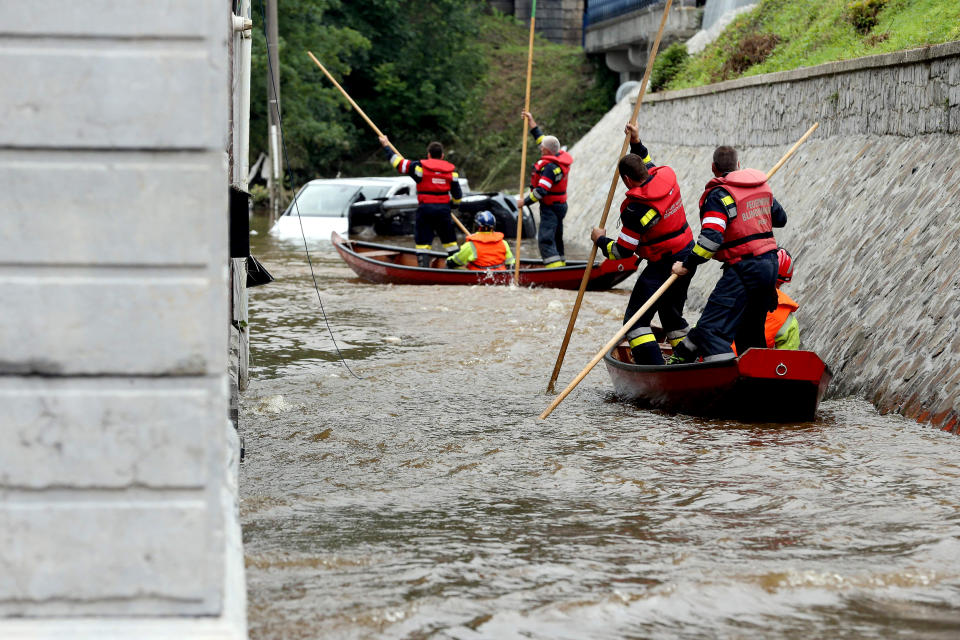 Image: Austrian firefighters steer a boat in a flooded street in Pepinster, Belgium on July 16, 2021, where the situation remains critical after the heavy rainfall of the previous days. (Francois Walschaerts / AFP - Getty Images)