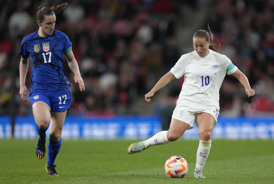 FILE - United States' Andi Sullivan, left, and England's Fran Kirby in action during the women's friendly soccer match between England and the US at Wembley stadium in London, Friday, Oct. 7, 2022. (AP Photo/Kirsty Wigglesworth, File)