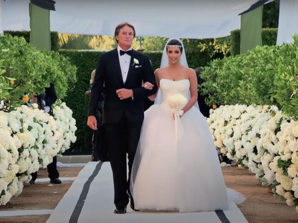 kim kardashian and caitlyn jenner walk down the aisle during her wedding to kris humphries