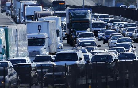 FILE PHOTO: Automobile traffic backs-up as it travels north from San Diego to Los Angeles along Interstate Highway 5 in California December 10, 2013. REUTERS/Mike Blake