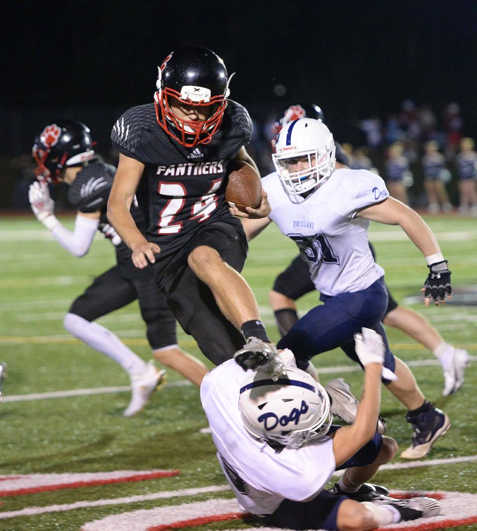 Whitman-Hanson's Trevor Googins, carries the football during a game versus Rockland on Friday, Sept. 24, 2021.