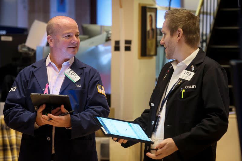 Traders work on the floor of the NYSE in New York