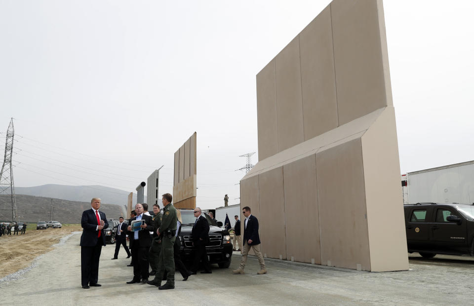 President Donald Trump&nbsp;tours&nbsp;U.S.-Mexico border wall prototypes near the Otay Mesa Port of Entry in San Diego. (Photo: Kevin Lamarque / Reuters)