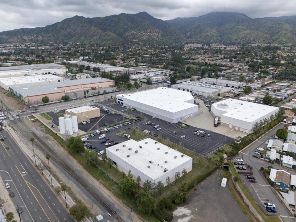 An aerial view of large buildings with flat roofs.