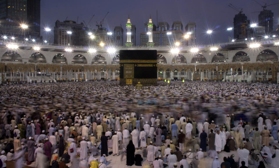 FILE - In this Oct. 3, 2016 file photo, Muslim pilgrims circumambulate the Kaaba, Islam's holiest shrine, the cubic building at the Grand Mosque in the Muslim holy city of Mecca, Saudi Arabia during the minor pilgrimage, known as Umrah that can be undertaken at any time of the year. A very small, limited number of people practiced social distancing as they circled the Kaaba in Mecca on Sunday, Oct. 4, 2020 after Saudi Arabia lifted coronavirus restrictions that had been in place for months allowing the limited restart of Umrah pilgrimages. (AP Photo/Amr Nabil, File)