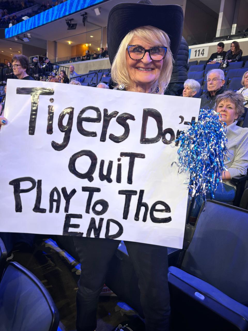 Memphis fan Marla Nitsch holds up the sign she made for the Tigers' Feb. 22, 2024 home game against Charlotte at FedExForum.